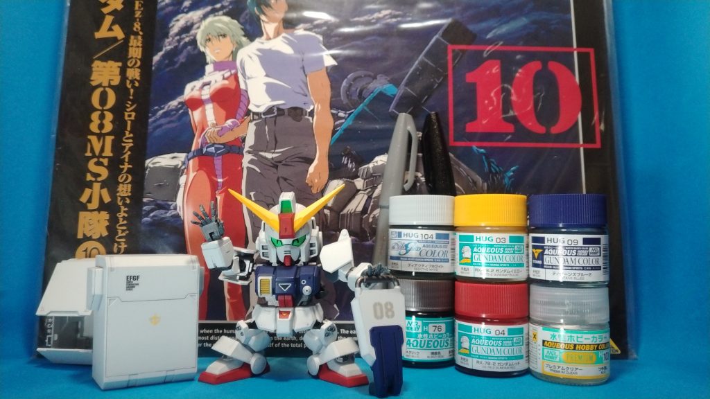 最後は使用した塗料と思い出の品と一緒に笑顔で(gundam-kao6)08小隊は当時リアタイでレーザーディスクを購入していた事もあり、とても思い入れの深い作品の一つです。今回のフェスにはその主役機である陸ガンにて連邦側で参加させて頂きます!連邦側では陸ガンにEz8、ジオン側ではグフカスにアプサラスと好きな機体も多いのですが、CSの陸ガンが未塗装のままだったので、これを機に制作してみました。(間に合って良かった💦)所謂「輝き撃ち」なる物がオープニングの1シーンから来ている事は、このキットを購入した頃に初めて知りました。普通に見てたらそう言う解釈にはならんだろうとwネタとしては面白かったので乗っからせてもらいます(gundam-kao2)それでは、ここまで閲覧して頂きありがとうございましたー!!