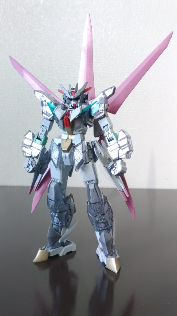 「聖腕 ガンダム・プロトアガートラーム」花びらのような意匠を持ち、妖精を彷彿とさせるフォルムと白銀のカラーリングが特徴の機体。半透明な装甲は試作品のため塗装されていない。アニメ本編では開始わずか5分未満で退場し、回想シーンとスマホのゲームの方が多く活躍している。ちなみにゲームだと「ガメラ3」に登場した「邪神イリス」モチーフのギアに変身している。