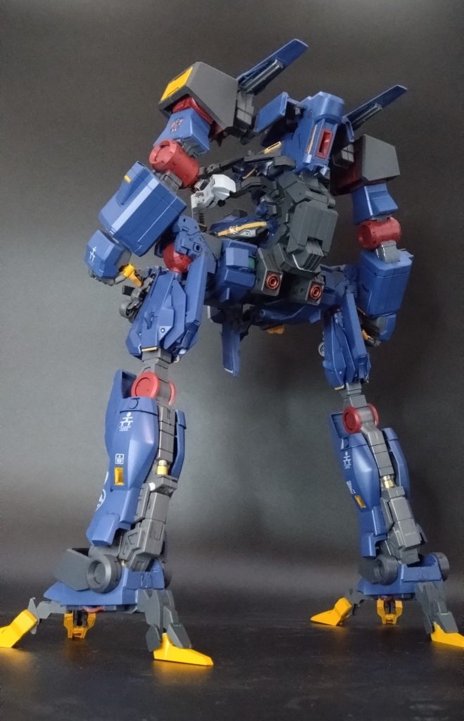 第一次ソロモン海戦でドズルのビグ・ザムを撃破したペガサス級所属の軽キャノンのセイラと軽アーマーのスレッガーの連携に着目しMSと支援戦闘機による連邦独自のMAV戦術を考え一年戦争末期時に立案されたMSとMAの攻撃を兼ね備えた起動兵装『デンドロビウム』を原型に近接戦闘を対応した人型可変機構を追加、ムラサメ研究所の独自サイコミュ・システム『スサノウ』を搭載することで試作サイコミュ搭載人型可変MA『ミコシ』を完成させた。