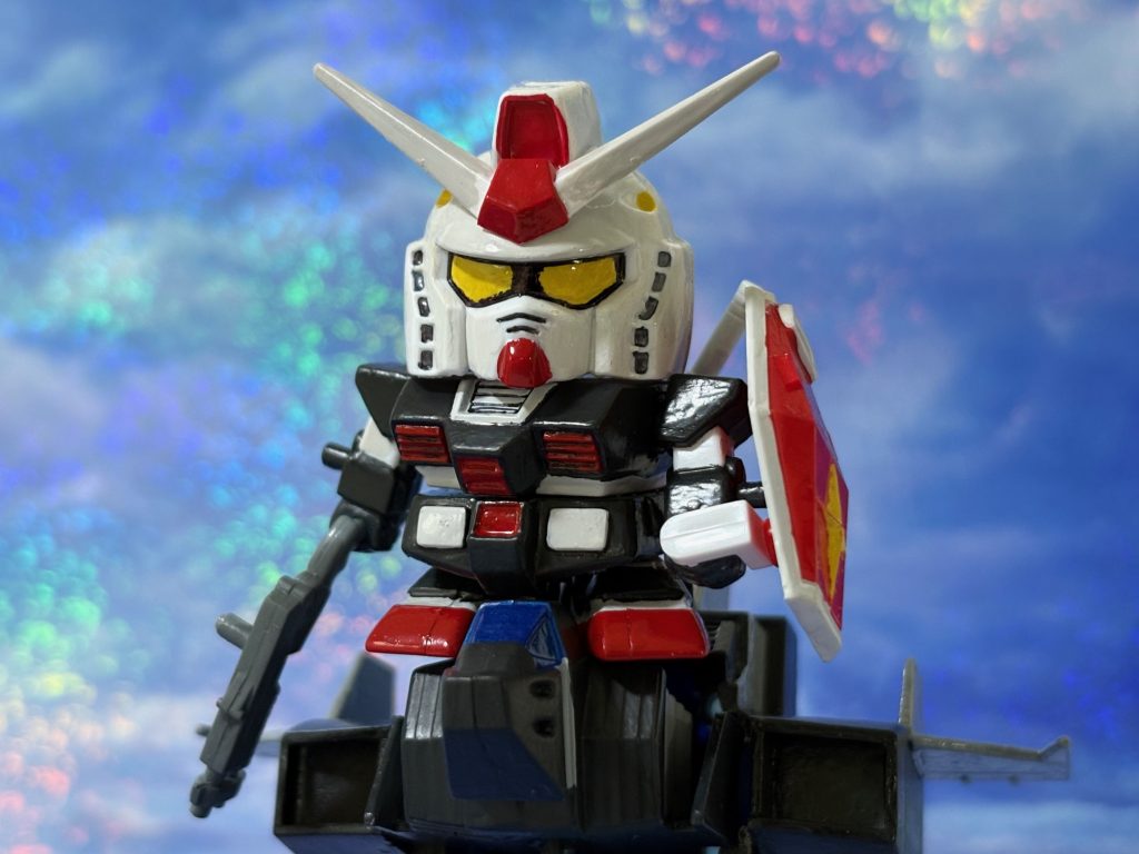 ユージ「タカのショータイムだ・・・」タカの黒いガンダムはハヤトが操縦するGスカイイージーに跨り、ガイアのドムと一戦交える。黒いガンダムの右腕にはショットガンが装備されていた。（BGMはTamara Champlinの「On The Run」をかけながら見よう。）