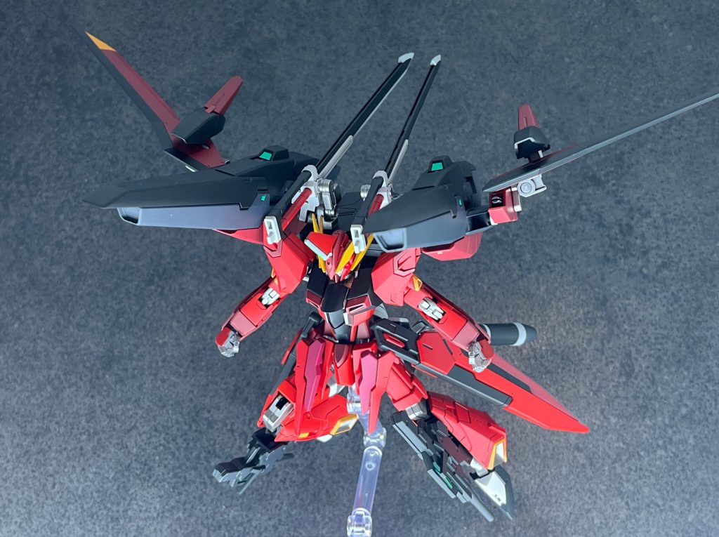 GNキャノン（エクスフォルティス)ファトゥムのコンテナユニットに搭載された、高エネルギープラズマ粒子砲。00系列のピンク粒子ビームではなく、SEED系列の赤ビームに変更されている（ため、GNシザービットをオミットしエネルギータンクを内蔵している）。高エネルギービーム砲コンテナユニットのサイドに付いたウイング基部のビーム砲。イモータルジャスティスの武装をそのまま採用している。