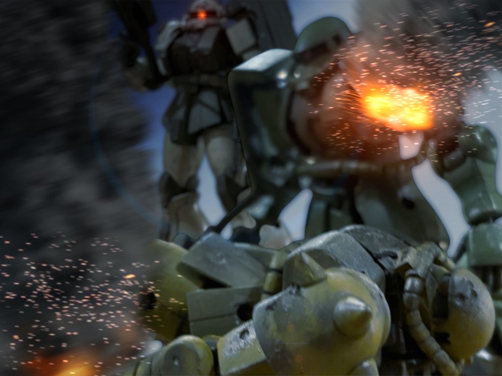 「待て、もう1機……?」ボブが不審の声を発する。 闇夜の中、ひとつ目の巨人の影が、炎に照らされている。 このベースキャンプには、ザクは2機しか配備されていないはずだ。