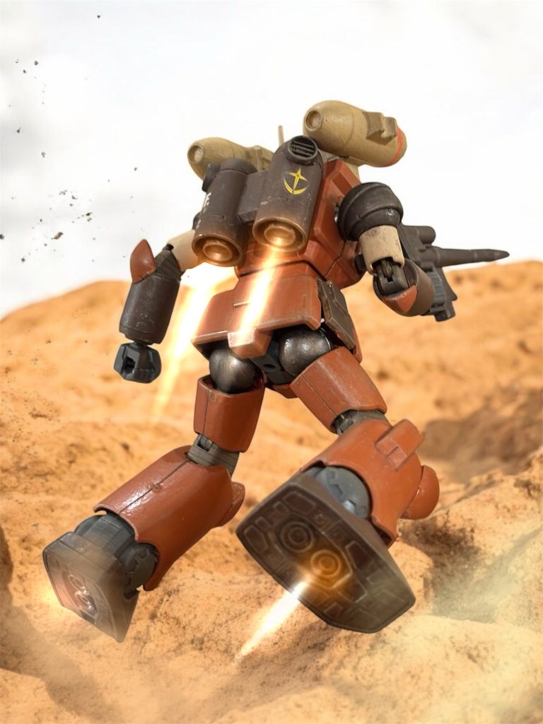 　先行するガンキャノンが、バックパックのバーニアを小刻みにふかし、岩場をひょいひょいと登っていく。１８ｍもあろう鋼鉄の巨人とは思えない、身の軽さと接地の柔らかさに感心させられる。『あいつは天才だな。』イギー・ドレイク少尉も舌を巻いた。「そう言ってあげればいい。曹長がお前を見る目も、少しは変わる。」『素直に褒める女はカミさんだけと決めてる。』その感覚は生きづらくなりやしないか、と思うと共に、イギーらしいな、とヘント・ミューラー少尉は思う。思うが、口には出さない。『”モルト”より、全隊。特に異常はありません。』高台に立つガンキャノンのパイロット、キョウ・ミヤギ曹長から、涼しげな声で通信が入る。