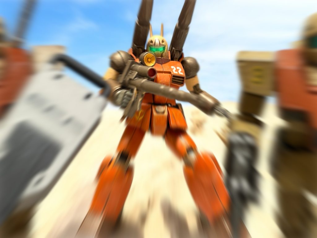 例の稲妻の走る感覚の後、次いで、肌をつき刺すような、鋭いプレッシャーが全身を襲った。「何っ……!?」激しい、敵意というか、生の感情が、前方の砂塵の中から自分に向かってくるのを感じる。「敵!?全機、警戒!」率いている中隊に通信を送るが、レーダーはまだ敵機を捕捉していない。『曹長?』2番機が応じた瞬間、ミヤギの