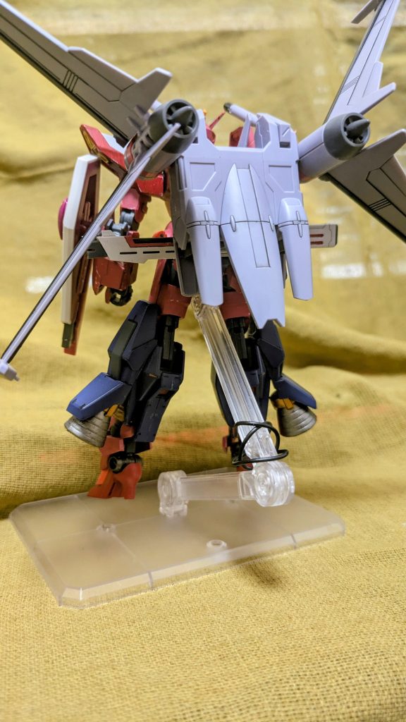 改修ポイント・肩アーマーからストライカーパック互換性を排除、代わりにスラスターを内蔵することで反応速度上昇・マーズアタッカーの脚部ブースターを正式採用。着脱式から固定式に変更したことで剛性上昇・脚部を小型のヒールタイプに変更し、空力特性を強化・両腕部にビームシールド発振装置を装備・設定上、内装を第2世代核動力へと変更しエネルギーダウン問題の解決と同時に装甲材質をVPS装甲へ換装・M.A.R.S.の搭載