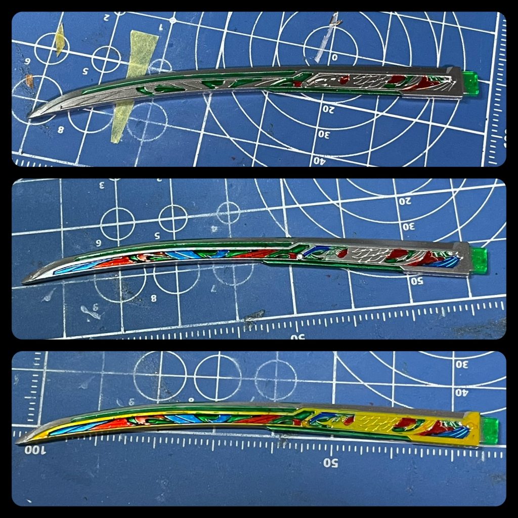 輝羅鋼刀「武輝丸」の裏面は下地をMr. スーパーメタリック2のスーパージュラルミンで塗ってから、水性ホビーカラーの各種クリアカラーで筆塗りしました。はみ出たらマジックリンで拭き取りします。クリアイエローはそのままだと色が薄くて大変なので、色の源イエローを混ぜて塗ってます。よく見ると塗り分け汚いのでアップ禁止😵