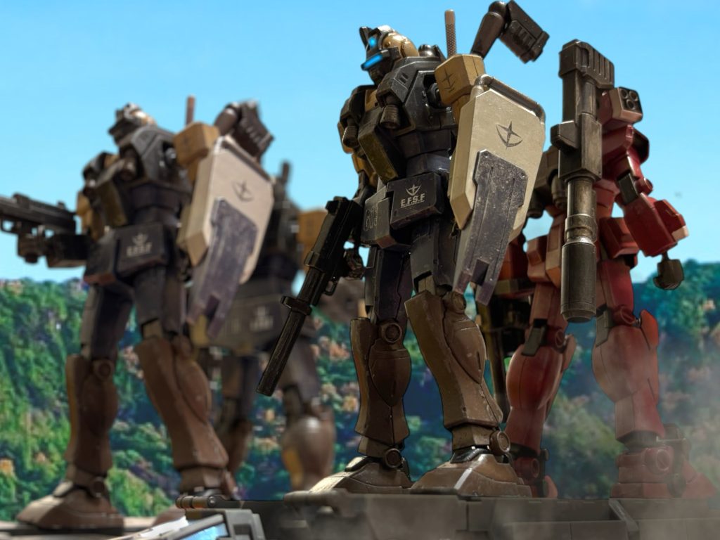 『夜に慣れすぎた。明るい中の進軍は目がチカチカする。』「お前、少しは黙ってられないのか。」 トレーラー上で揺られる機体で、相変わらずのトニーに思わず釘を刺す。『会敵予想地点まで、あと600秒だ、気を引き締めろ。』 ケーンから通信が入ると、トレーラーが止まった。ここからは、徒歩で進軍する。この先に、ジオンの小規模拠点がある。確認している敵機は、せいぜいMS2個小隊程度だが、数時間前からミノフスキー粒子を戦闘濃度で散布している。敵も襲撃に備えているだろう。『事前に確認したとおりだ。フォーメーション”ドラゴン・ジョーズ”でいく。』『……了解。』何のことはない、2機1組に分かれての挟撃だ。楕円軌道での突撃が、竜の咢のようだというネーミングらしい。『Aユニットは、”ノーススター””チージー”、Bユニットは、”デューク””チェリー”。』 ケーンが最終確認の通信を送る。ジンは、先ほどあてがわれた自分のコールサインに、不快感を感じる。自身は”レックス”を提案したが、トニーが機体色を理由に、ジンの提案を覆した。(こいつ、思考が思春期ですから。ほら、”俺の傷がうずく”とか言ってそうなタイプですよ。ジュニアハイのときいませんでした、そういうやつ。)ジンは思わず優等生の擬態を解き掛けたが、まあ、呼び名などどうでもいいと思うことにした。お前、隙があったら撃ち落してやるからな、と、ジンも、軽口で応じた。『では、行くぞ。』 ケーンの、快活だが深みのある声に、ハッと我に返る。 ジンは、舌なめずりをして、機体を走らせた~~~~~~~~~~~~~~~