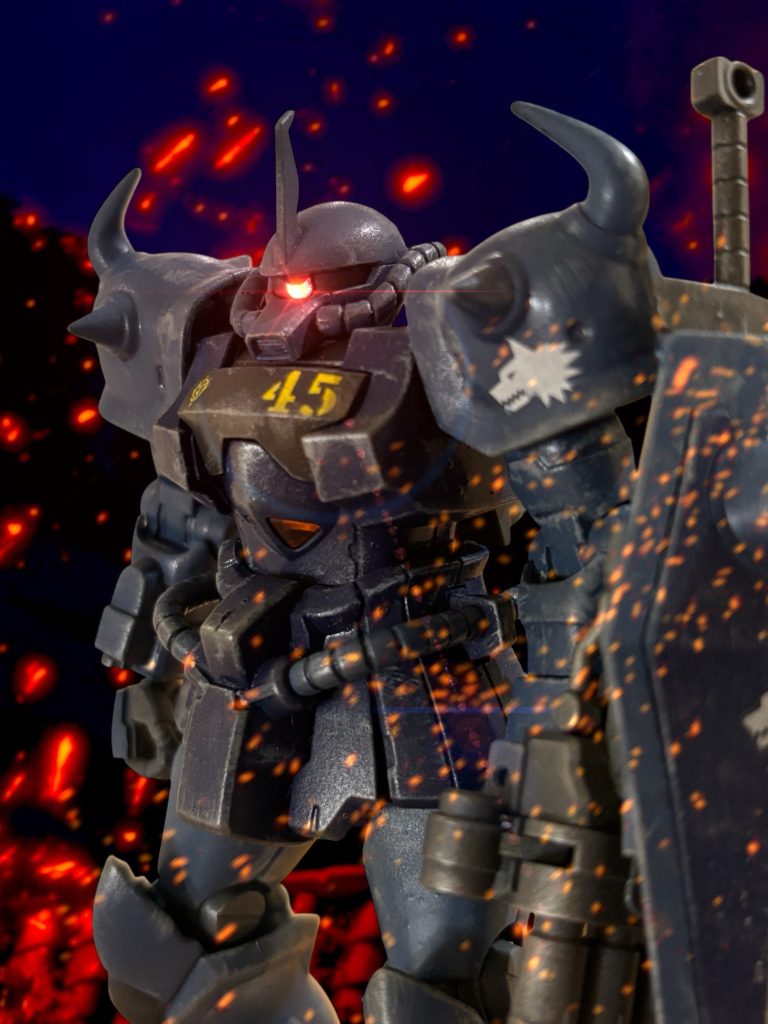 拠点まで後退したウォルフガングは、炎に包まれた戦場のその異常さにすぐに気がついた。 敵はいなかった。ここに来るまでに、敵MSと、それを空輸してきたと思しきカーゴ型航空機の残骸もあった。カルアが、空でうまくやったのだろう。敵を壊滅させたか、退けたらしい。 だが、味方もいない。 味方も悉く、その無惨な亡骸を大地に横たえていた。 不意に、味方の反応を示すアラートが鳴る。「カルアか——?」