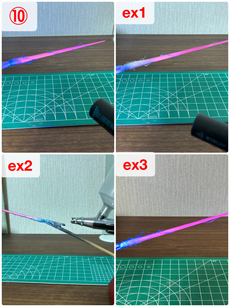 ⑩ブラックライトで照らして、問題なければ光沢クリアコートします。使うライトと距離で光り方が変わるので、本番?想定で。以下は調整手順です。ex1 光り方が弱いと感じたら、根元の膨らみを中心に白を吹きつけます。これだけだとむしろ光らなくなるので、次のステップへ。ex2 等身を寝かせて根元から先端方向へかすらせるように蛍光ブルーを吹きます。ex3 羊毛の蛍光ブルーが復活して光量が上がりました。あとはライトの出力や距離で調整してください。また、剣先付近のバチバチの青がしつこく感じる場合は、刀身ごと蛍光ピンクを吹きつけてOK。最後に光沢クリアコートすると光が反射してもう少し光るようになります。
