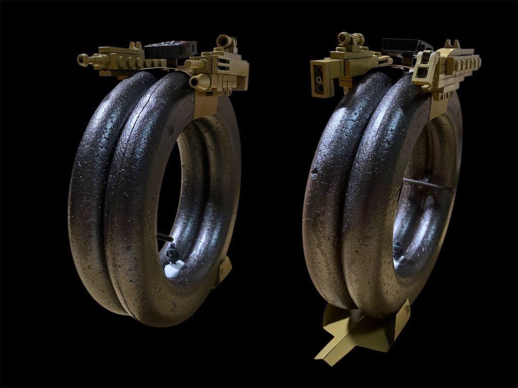 正面。季節商品の発泡スチロール製レリーフ二つを塗装して二つ一組に接着。ミサイルの土台やタイヤストッパーはプラ板で製作^_^