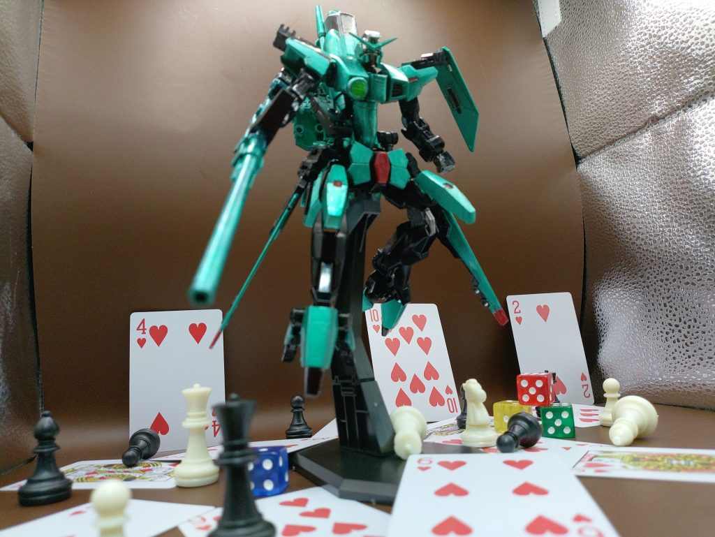 ◯ガンダムデュナメスソレスタルビーイングにおける索敵及び狙撃を担当する、ハートのマークを司る機体。レーダーやモニター外から目にも留まらぬ速度で、次々と機体に穴を空けて落としていく事から「貫通の奇術師」と呼ばれる。頭部の上部に狙撃センサー、胸に広範囲索敵ユニットを持ち、狙撃及び索敵能力が非常に優れている。広範囲索敵ユニットは、通常のMSの5倍、他のソレスタルビーイングのガンダムの2倍以上の索敵が可能となっている。