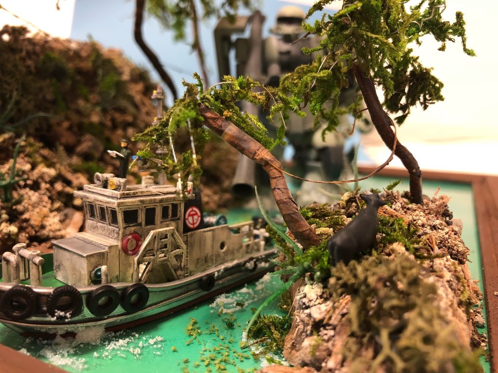 左側面からザクを引率する現地協力員。ジャブロー侵入口を探すため、地形に詳しい現地スタッフを雇い、偵察する地上部隊。…という設定。