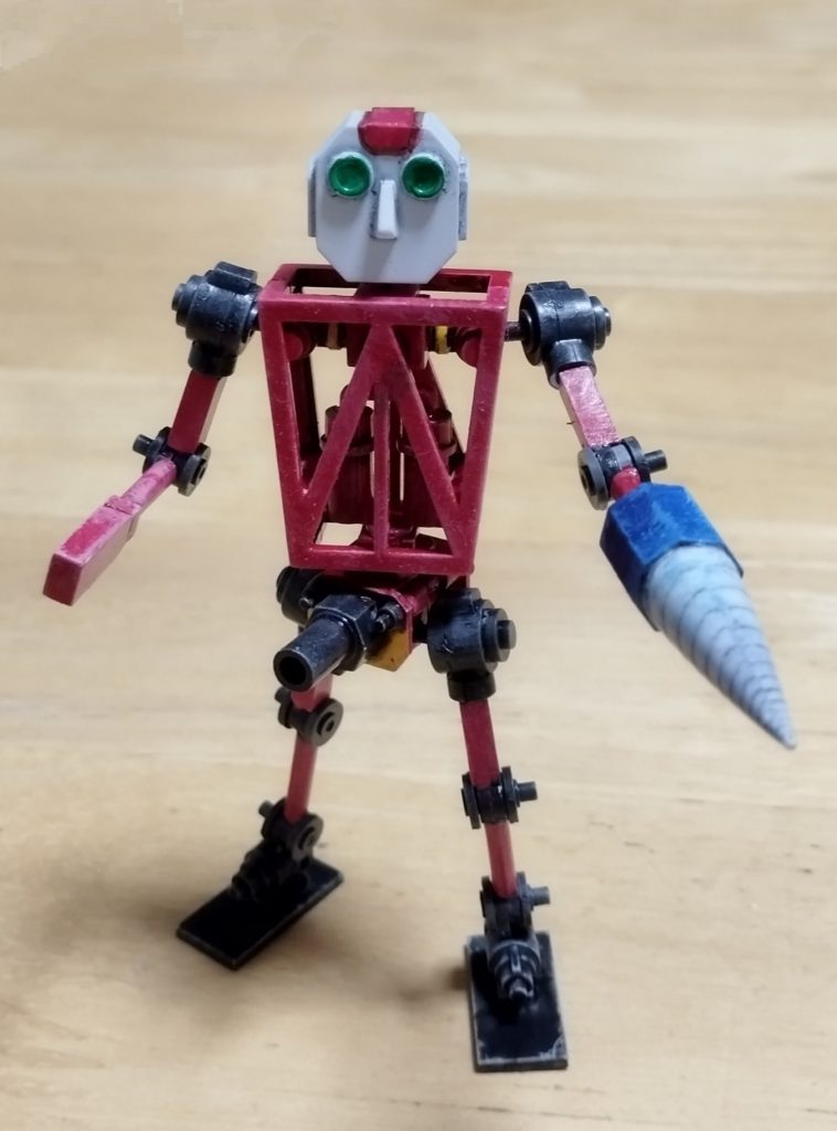 こちらの画像をアップして「このロボットが都市のビル街で大暴れしている画像を作成願います」と打ち込んだだけで個の出来上がりです。よく見るとポーズも変えてあるしすごすぎる。