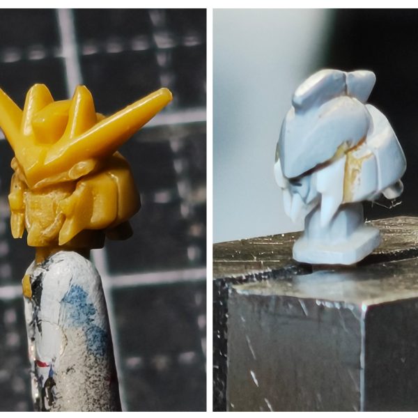 ガンダムアーティファクト第1弾のhi-νガンダムの7度目の改修しますｗ【頭部】①アンテナブレードの作り替えと額のバランスのため、アンテナブレードごと額部分をそぎ落とし、エポパテ盛る。フェイス部分もそぎ落とし、プラ板で3パーツで作る。真ん中部分、その両サイド、口の構成。②頬の部分をそぎ落とし、プラ板でディテール追加したものに置き換え。③頬横のダクト部分をそぎ落とし、プラ板で箱状にし、置き換え。④アンテナブレードの制作。1.2㎜のプラ板をＶ字に切り出し、持ち手兼アンテナブレードの中心ディテールになるプラ板で接着。ひたすらヤスリで尖がらせる。最後に持ち手を中心ディテール分を残しカットし、ダイヤモンド状に削りだす。トサカもボリュームとセンサー部分のディテールを追加できるようにプラ板を左右、上面に張り付ける。小さいアンテナブレードは最後の方で制作しくっ付けます。今作ると折れるのでｗいい感じに出来てるかな～（3枚目）