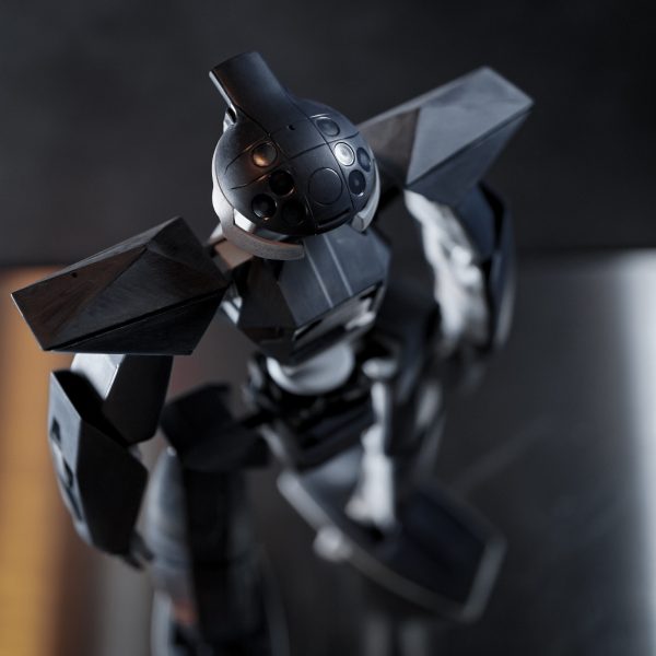 旧キットの不人気モビルフラット。1999年発売と古くて定価550円という決してクオリティの高くないお手軽キット。各面と目に付くバンダイエッジを片っ端から丁寧に処理してペラペラ感を増す方向で進めます。プロポーションはデザイン的にキットのままで別に間違ってない気もしますが個人的な好みに寄せる方向で、胸部を削りこんで薄くし角度も変更、腰部と首を延長したり、あとグローブをはめたようなデカいハンドパーツは別キットから小さい物を流用しちゃんと萌え袖になるよう改造しました。背中のディテール部は開口して中にジャンクメカパーツ詰め込みで立体感を増し、特徴的なスリッパもプラ材をぐるりと貼ってから削りこみ。おそらくターンエー好き&シド・ミード好きの人なら腕部と脚部の裏面ディテールを見せ場として作り込むところ、ターンエーは肌に合わなくてアニメをほとんど見てないしモビルフラットの活躍もよく知らないしシド・ミードも全然好きじゃないのでただただ面倒で手をつけず。ヒジとヒザとか設定画に合わせて徹底的に作り込むとなると可動と変形を犠牲にしなければいけなくなるので、見なかった事にしてスルー予定。人気もなく自分も別に好きじゃないMSにそんな手間をかけるモチベーションが無い。でも装甲パーツをヤスって面とエッジを整えていく作業はとても楽しく、パーツ点数が少ないしやればやっただけ効果絶大なのでとても楽しい作業。(6枚目)