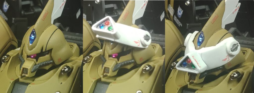 三連式多目的カメラモジュール狙撃能力向上の為に装備されているバイザー式カメラモジュールで、バイザーの上げ下げの他緊急時は爆発ボルトによる強制排除が可能となっている。頭部のブレードアンテナが装備されていた場所には、センサーカメラが追加されており、代わりにボディ右側にロットアンテナが装備されている。