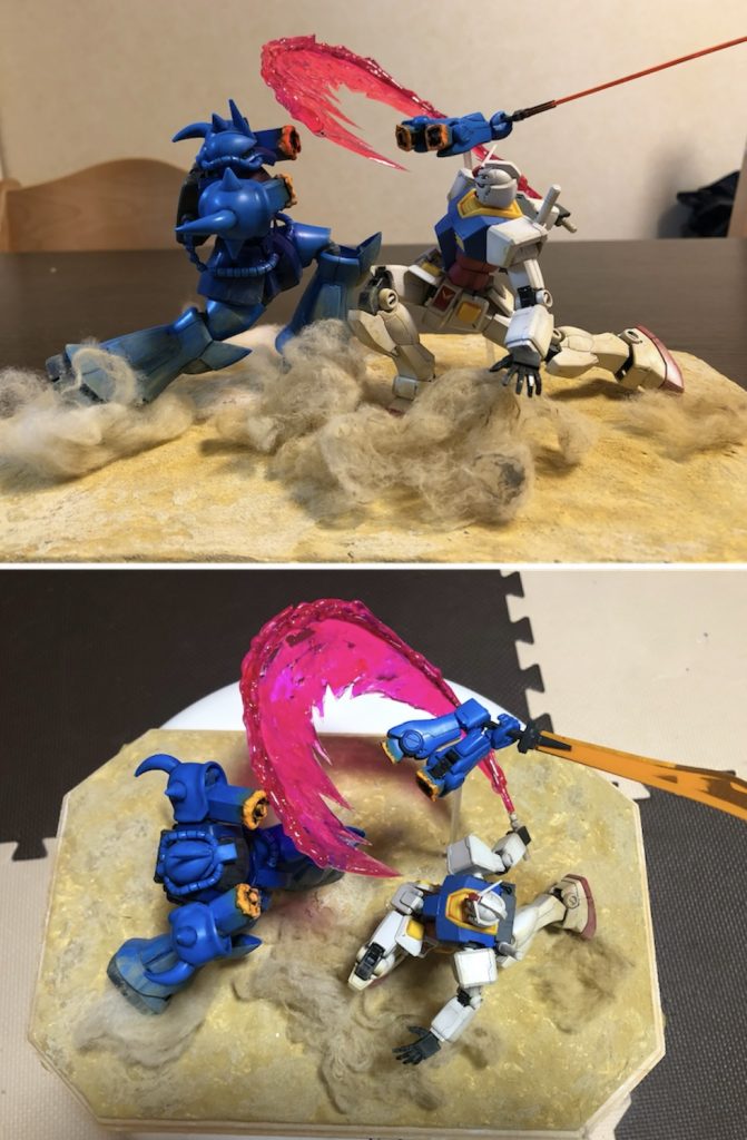 ⑤空間の活用⑶同じくA4サイズジオラマを大きく広く見せる工夫。この作品もベースに対し2体は平行ではなく、それぞれ対角線に対し平行に並んでいます。切り飛ばされたグフの腕がガンダムより遠くに配置され、正面写真では少し小さく見えることで空間の奥行きを演出しています。また、ファーストの地上戦では同じぐらいの大きさのMSが戦うため高さが出ず迫力不足になります。そこで空中にビームサーベルと切り飛ばされたグフの腕を配置して迫力を増しました。余談ですがジェットストリームアタックの回は高さを使った戦闘シーンが秀逸だと思いました😊