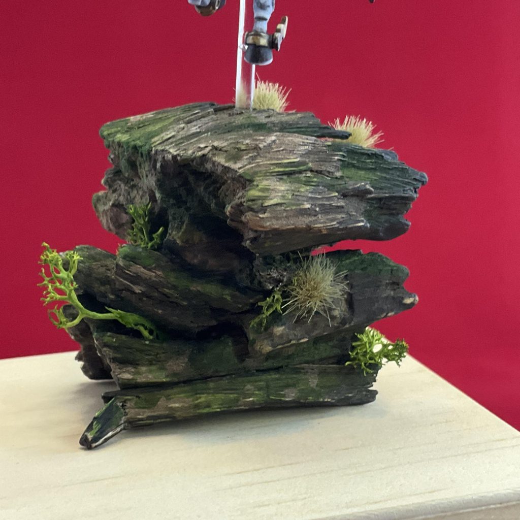 I changed the base to this pile of dried driftwood, which was painted in washes and then moss effects and dried moss were added.&nbsp;