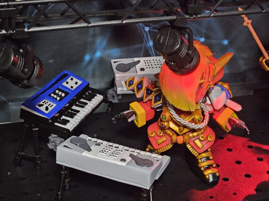 細かいボタンにはタミヤのプラ材1mm丸棒を刺していきました。