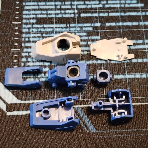 初めてのミキシングなので、両方のキットをまず完全に組み立ててからパーツをいじるのが一番だと思っています。固まらないパテ(こちらではブルータックという名前です)で接着しています。
今のところ、かなりかっこよく仕上がっていて、イメージにかなり近いと思います。皆さんはどう思いますか?
今後目指す変更点:
GN-Xの丸い腕を、四角いケルディムの腕に交換する。
足のサイズを大きくする。
頭部の触角を変えるかも。
四角いプレートを胸部に貼り付けました。腰部との連続性が生まれて嬉しいです。うまくいきました!
これがどれほど大変な作業になるかはすぐに分かりましたが、ワクワクしていて、狂ったようにハッキングを始めるのが待ちきれません。
新しい道具はいつ配達員が届けてくれるのでしょうか?もうすぐですね。As this is my first time mixing, I feel like the best direction is to build both kits fully and then play around with parts. I stick them together with a putty that doesn't set. (It's called Blu-Tak here.)I think it looks pretty cool so far and quite close to what I imagined. What do you guys think?Some more changes to aim for:Replace the rounded GN-X arms for the square Cherudim arms.Increase the size of the feet.Maybe alter the antennae on the head.I stuck the square plates to the chest. I'm very happy that they provide continuity with the waist. It works! I've quickly come to realise how much effort this is going to be but I'm very excited and can't wait to start hacking away like a mad man.When will the courier bring my new tools? Not soon enough. (4枚目)