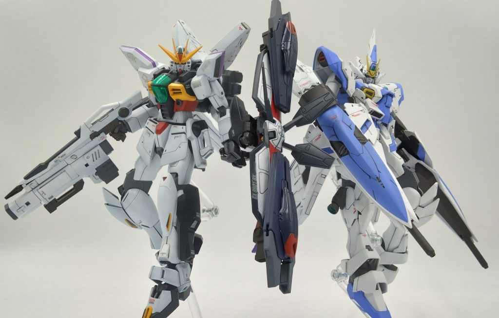 本機二体の初陣は謎の教団が秘匿で隠していたあのカリスにとっての因縁の巨大MAパトゥーリアがエスタルドに襲撃すると報告にこの二人の若きガンダムパイロットが出撃した。二人の連携によりものの瞬間で敵雑魚バルチャーMS群とパトゥーリアを撃破した。これを若者二人を見てジャミルは笑顔で微笑んでこの子たちに希望を託し悩んでいたガロードに一言・・何も考えず走れ！ガロード！