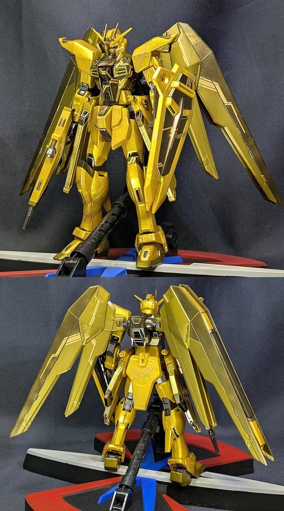 デカールは黒,白,ガンメタ,グレー、色の種類はたくさんあるが、成型色を活かしたかったので同じ金色を選びましたと言いつつも、デカール作業前の過去作状態で全体に光沢クリアにゴールドを極少量混ぜたものを、関節はガンメタ、元が赤いパーツには偏光塗料のマゼンタゴールドを塗装してますデカールは左上から右下に稲妻が走っているかのように貼り付けました