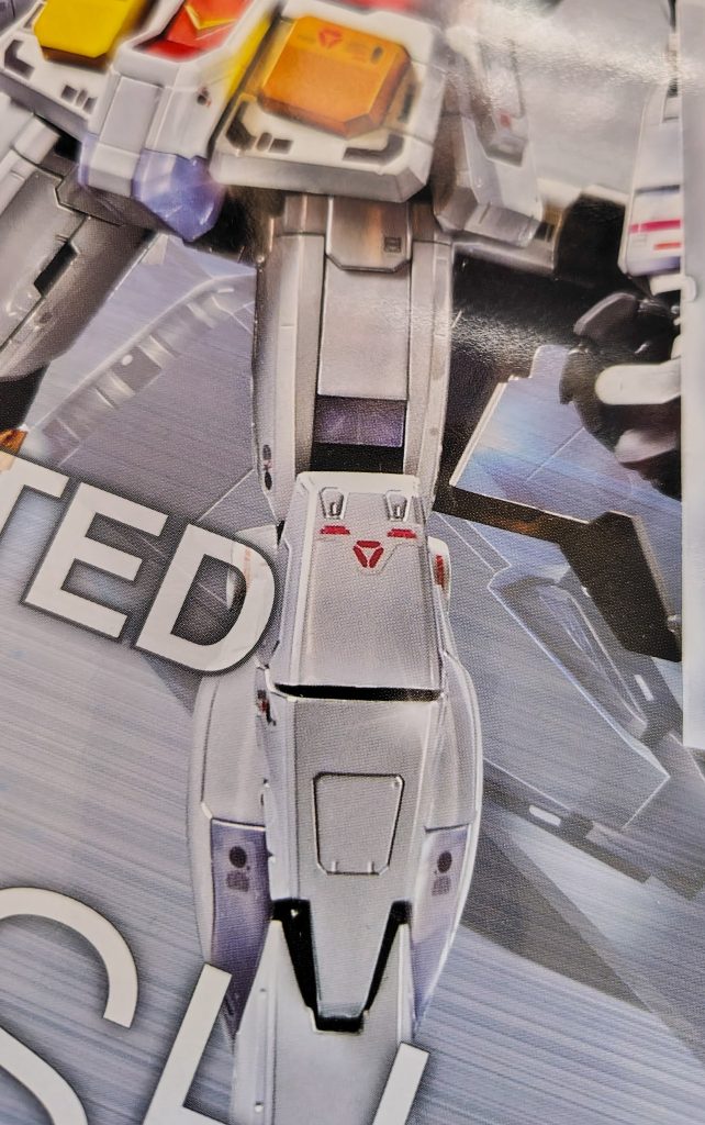 作品名：にこっ<p>チタニウムフィニッシュガンダムの膝あたりのシール。 にこっ(´▽｀)としたお顔にみえて、ついつい見かけるといっしょに微笑んでしまいます。ほのぼのかわいい。</p>
