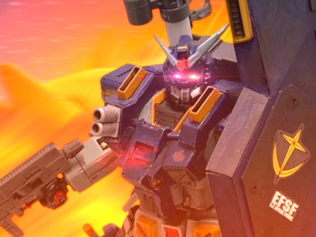 　ハッと我に返る。　モニターには、巨大な火球と化したザンジバルと、敵味方入り乱れるMSの群れが見えた。（やったのか、わたしが——！？）機関砲が火を吹いたのと、ザクが出てきたのを見た瞬間、考える間もなく反射的に引き金を引いていた。やはり、武装解除は偽装だった。奇襲、と言うほど大胆なことは考えていなかっただろう。だが、この状況で選ぶべき手ではない。連中が選択した行動は、撃ち返されて当然の裏切り行為だ。&nbsp;