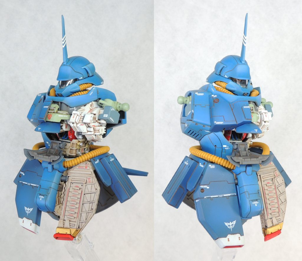 ■胸部・腹部 元々、胸部コクピット内の天井部分には「ガンプラ用LEDユニット」(別売)を設置するためのスペースがあるため、透明プラ板で天井を自作してLEDを1基取付けました。電池ボックス兼切替えスイッチは、先述のスペースに収めています。胸部左側の外装は取り外し、ミカド屋のレジンパーツやプラ材等を貼り付けて内部メカの密度感をアップさせました。コクピット内は全天周囲モニターの鏡面を再現するため、内部の壁面にハイキューパーツ製のミラージュグリーンシールを貼り付けており、電飾の光を乱反射させています。 コクピット内部を見せるために、コクピットハッチの下側のパーツの取付位置を上側に5.0mmずらしました。 胸部の一部及び腹部の外装は、タミヤの精密ノコギリ(エッチング製)で中央を切断し、断面をヤスリで整えました。内部メカの表現として、左脇腹にミカド屋のヒートシンクやプラ材による自作パーツを貼付けています。脇腹のシリンダーは、アクセントとして金属色で塗装しました。