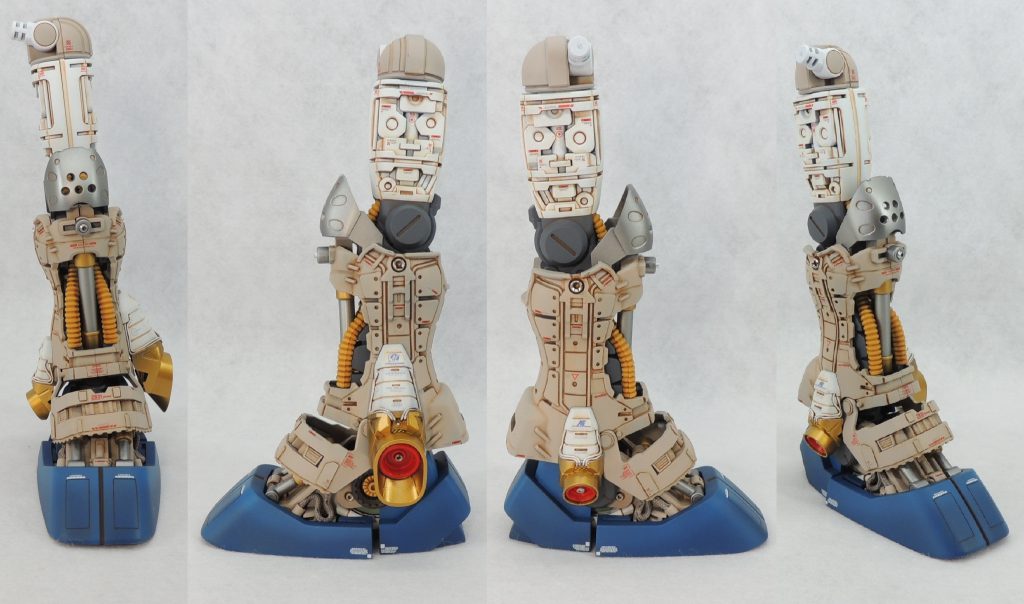 ■左脚部 左脚部は、外装のほとんどを取り払い、内部メカを露出させました。サブスラスター周辺にはタミヤのパイピングケーブルを這わせて精密感をアップさせています。先に完成させたジェガンの内部メカの配色やマーキングをそのまま踏襲することにより、敵味方双方のMSが同一企業により製造されていという説得力を持たせました。 全体的につや消しですが、模型的な盛り上がりを考えて、所々金属パーツや金属色を使用したり、マーキングにレッドのコーションマークを用いたりして、アクセントにしました。