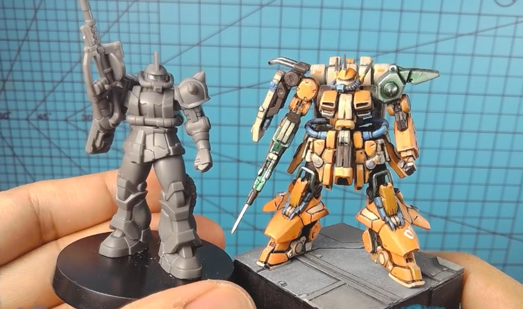 Gundam Assemble Char's Zaku with Gundam Artifact Char's Zaku II. &nbsp;I was surprised that they're so close in size. The Artifact mini has more separate parts, although most Artifact kits have simple poses while Assemble minis are more dynamic.&nbsp;