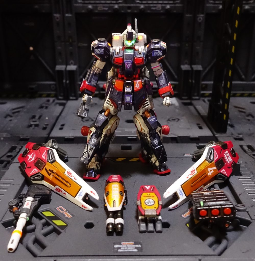 6.&nbsp;&nbsp;&nbsp;&nbsp;武装は腕部二連ビームライフルや、腕部ロケットランチャー、バックパックにビームキャノンとミサイルポッドが取り付けられており、こうした装備もフルアーマーガンダムを彷彿とさせるものとなっているが、この時代の中隊規模でのパトロールには、このくらいの装備がないと暗礁宙域の武装組織の暴挙を抑えきれない必要不可欠なもの、とされていた。