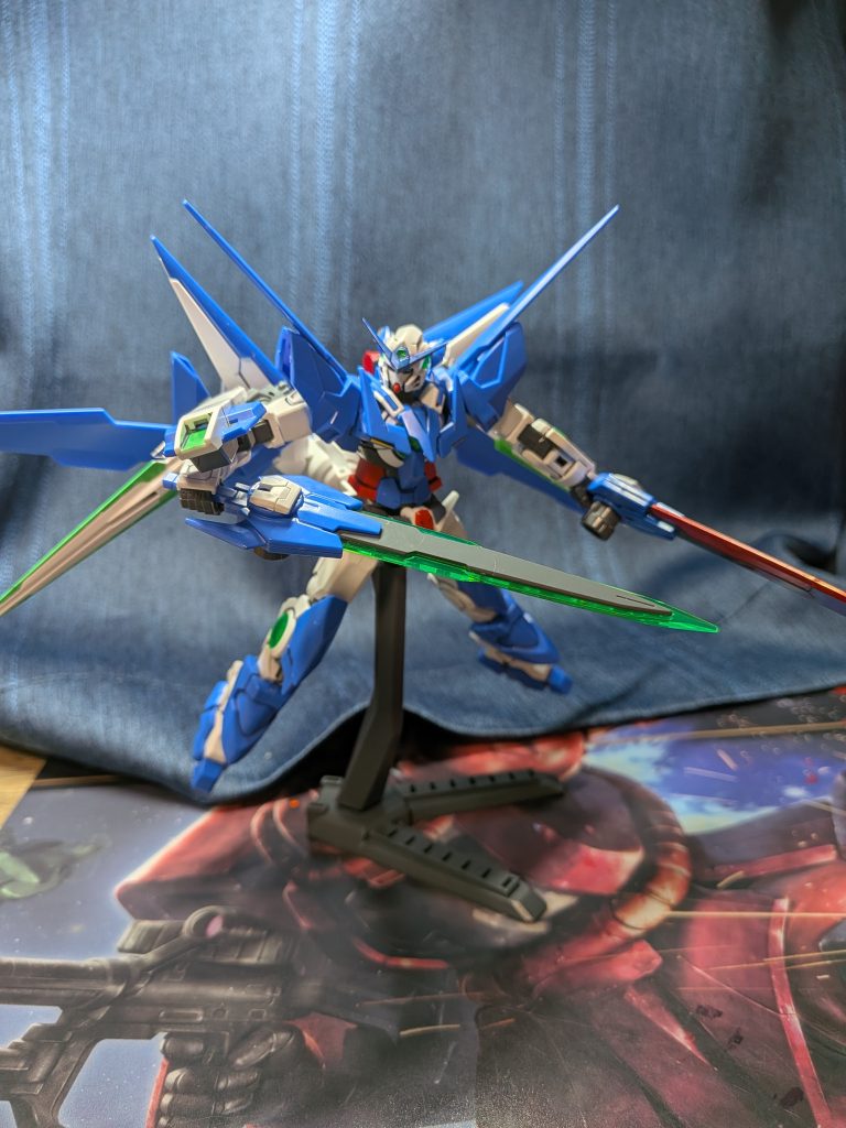 本機はチーム「ビルドグゥレイト」に入った「シント」が製作したガンプラであり、エクシア2号機があったらというイメージで製作された。もちろんセブンソードである。GNスラッシュブレイドはGNソードIIIと同じ素材を刃に使用したものと赤い刃を使用したものがある。どちらも切れ味が優れている。