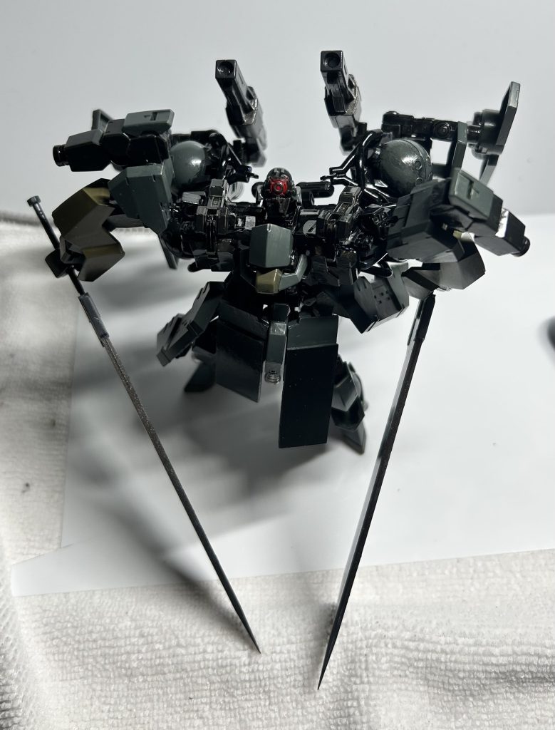 ある企業の秘密兵器–3枚目/制作者：ジオニックの社員