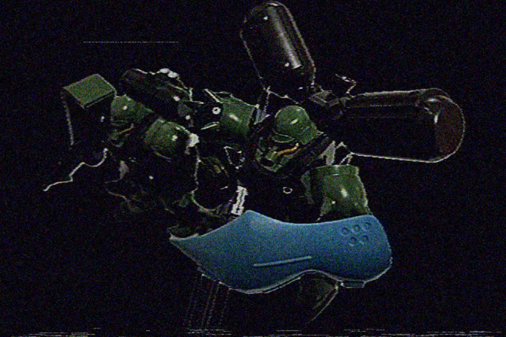 　ちょうど同じ頃ラビアンローズ級ロサ・ギガンティアＩＩのエンジンブロックに近づく二つの機影が監視映像に姿を現した。「ん？」　監視員の一人が目を凝らして拡大されたそれを見る。勿論、ミノフスキー粒子なんて撒かれるはずはないので、これは実体映像だ。その機影はＭＳだった。色は緑と分かる。その頭部に当たる部分がカメラを凝視する。その数秒後、映像は砂嵐に変わった。「これは…ミノフスキー粒子⁉︎しかも戦闘濃度じゃないか！」　隣にいる環境管理員が叫んだ。　その直後、ロサ・ギガンティアＩＩは大きな揺れに包まれた。「何だ、この揺れは！」　それは重力ブロックにいたアンクレ・ロロ達にも伝わっていた。「敵襲か⁉︎」「そんなまさか…ここは金星ですよ中将」「いや…」　パゾリーニの言葉を遮るようにＶＦＣのスタッフが部屋に入ってきた。「局長、中将、機関部で爆発を確認しました！お二人は直ちに脱出艇に急いで！」「何が来たんだ！」　アンクレ・ロロは恐怖を紛らわせるために叫んだ。「監視映像にモビルスーツらしき機影がありました。恐らくそれでしょう」「チイッ！」