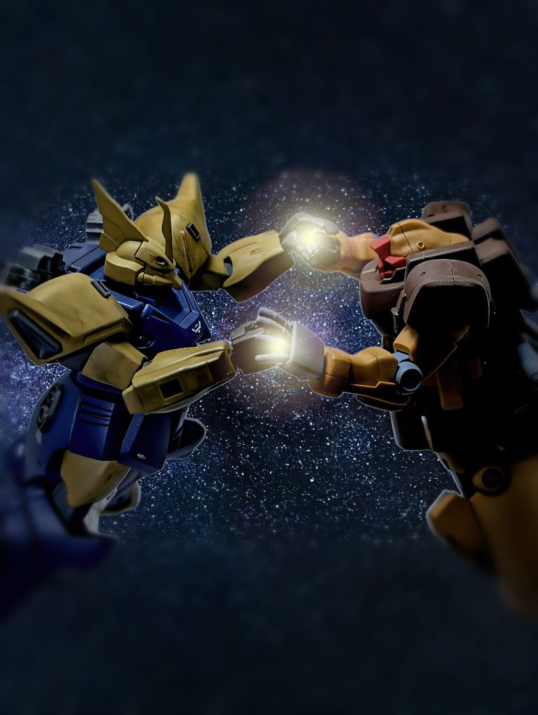 宇宙の蜉蝣2よりワンシーン。ゲルググM指揮官機代理でゲルググJ改と、プロトタイプ・リック・ドム(エギーユ・デラーズ専用機)代理でドム・トローペン(サンドカラー)。ガトー「中佐！お気を確かに！」シーマ「デラーズ閣下の所のエースパイロット……」ガトー「今は、大義の為に堪えるのです！」シーマ「……そんな説教、聴いてないし…」ガトー「軍人として、大義の為、今は雌伏の時…」シーマ「……知らないし、そんな事。好きにすれば？…」