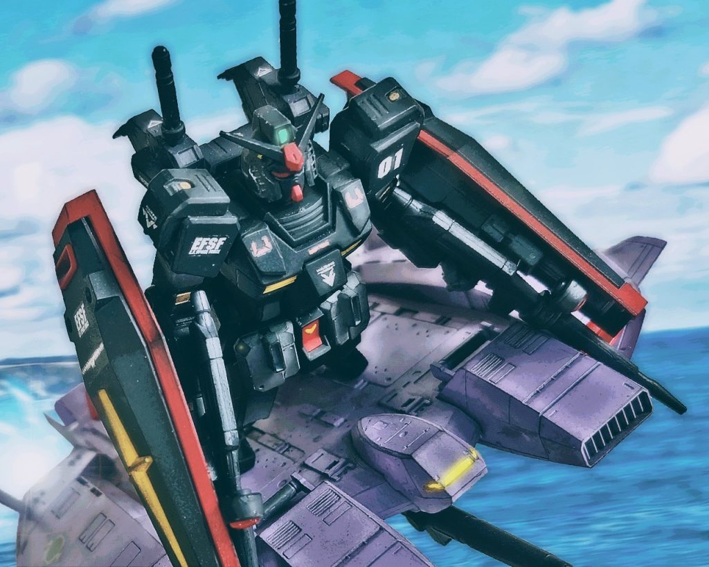「…もうすぐだね」セカンド・ムラサメ少尉はRX-78MTガンダムムラサメ研究所仕様をベースジャバーに乗せると交戦空域まで向かった。セカンドの搭乗するガンダムは往年の名機RX-78-2ガンダムに似た形状をしているが、中身は別物である。強化人間の訓練用機体としてムラサメ研究所で使用され、コクピットもコアブロックシステムは廃止。全天周囲モニターに変更され強化人間を始めとするニュータイプ素養のあるパイロットの為の機体となった。一年戦争時、ジオン軍で使用された遠隔型サイコミュこそ積んでいないが、反応速度、動作の円滑性を向上させるネオ・マグネット・コーティングが施されている。これは操縦者の意志をダイレクトにマシンに伝達することにより、機体の反応速度と動作の円滑性に飛躍的な向上をもたらす、応用型サイコミュシステムである。「…応答なしか、いったい誰なんだ？」ムラサメ研究所まで戻っていたエゥーゴのβチームはガンダムに何度も呼びかけるが返事が返って来なかった。「だが、敵ではなさそうだ」「協定のおかげか？」ガンダムはβチームに対し攻撃を仕掛ける様子はなく、彼らより前方を飛行していた。βチームはそれを後ろから追い様子を伺う。「だが、気味が悪いな…」「何がだ？」「あのMSの残骸、奴が一人でやったとは思えん」「けれど他にMSはいなかっただろう？」「見た目はガンダムだが、旧式をレストアしたような機体でティターンズの新型と渡り合えるのか？」「まあ、ニタ研だからな。ムラサメ研究所の秘蔵ニュータイプが乗っているんじゃないか？」「………」