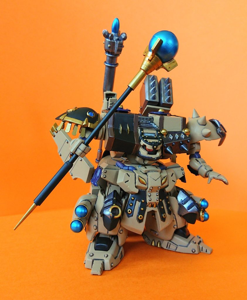 バトルメイジスタッフ。右肩に装備された錫杖の一振り。主に回復魔法や補助魔法の発動媒体とする。打撃武器兼用。w