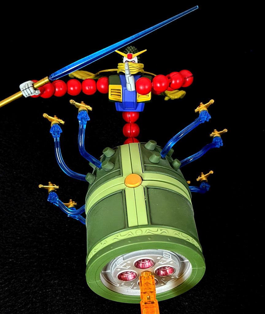 ミニマンダラガンダム射出ミニマンダラガンダムってなんだよ。師匠の十二王方牌大車併と同じようなものなのでしょうか。私個人の解釈で気で作りだしたエネルギー体が突っ込む技としたので色は金一色です。決して塗分けが面倒だったわけではありません。決して。あまり目立ちませんが底のバーニアも一応塗りました。