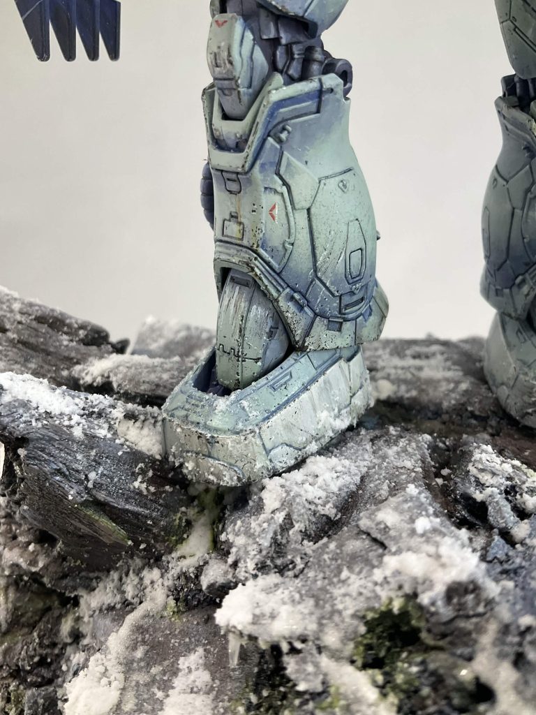 I used two texture paints to create the snow, Valhallan Blizzard from Citadel and Snow Sprinkles from AK. I also made icicles from clear plastic packaging and resin.&nbsp;