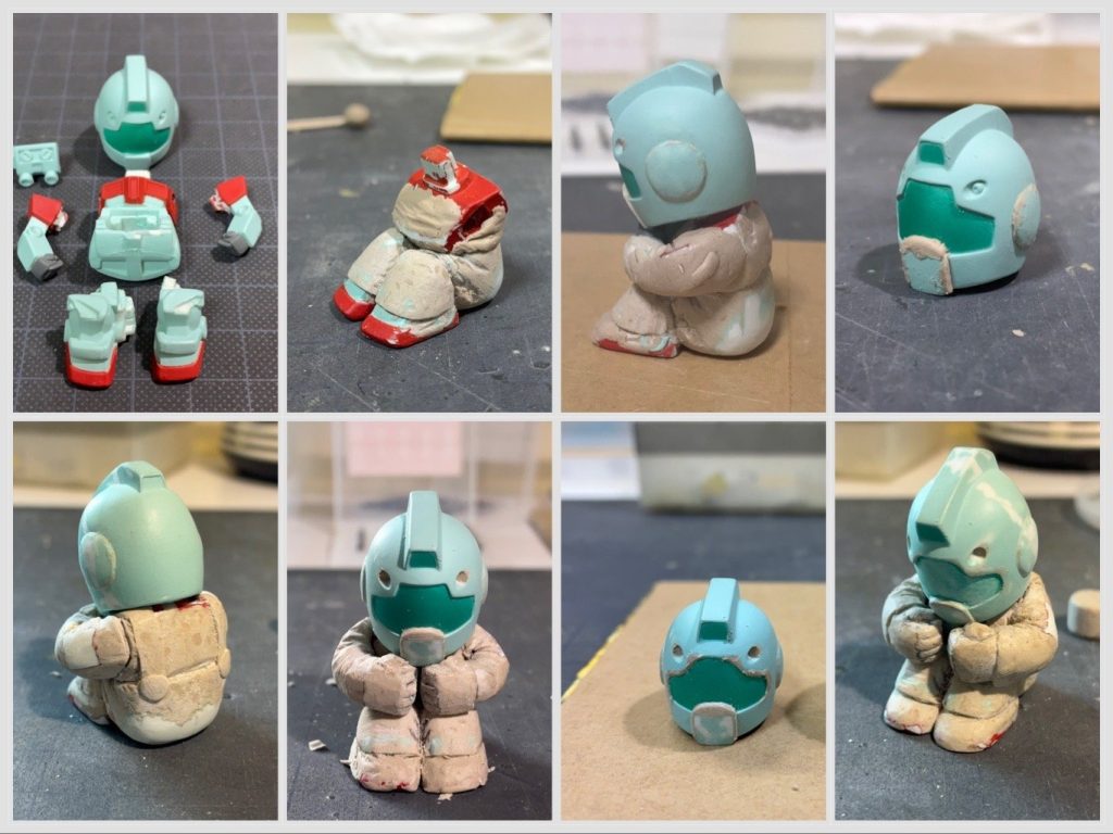 制作過程です。（左上から右へ、下段も左から右へ）お湯につけて柔らかくしてから分解足と胸部に盛り付け腕には服のシワを再現。背中のランドセルは外して埋めました。口周り耳の外周にパテを盛り、丸みを増す背中はほぼパテで成形拳にパテを盛り付けて一回り大型化したことで頭身が小さく見えるようにしましたゴーグルの凸の角にパテを盛り、丸い形状に変更ほぼ完成形状態