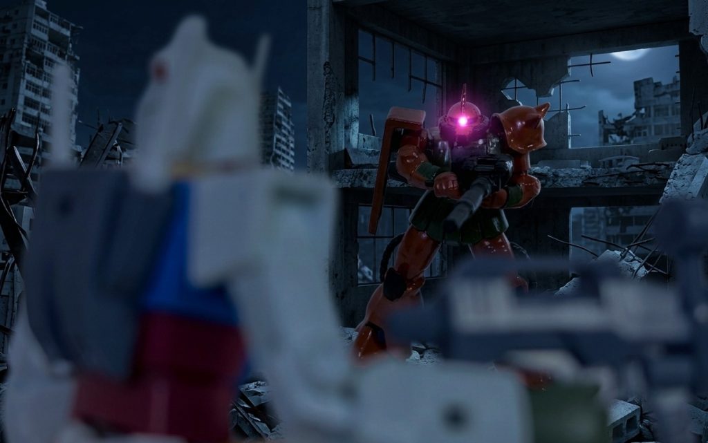 ニューヤークの戦いをイメージしたデジラマ。ガルマ「ガンダムめ、今度こそ落ちろ！」ユージ「女にイカれた男はなんでもするもんだ・・・」ちなみにタカとユージの二人はこっそりホワイトベースを抜け、しれっとニューヤーク市の官邸で開催中のパーティに参加しており、そこでシャアとガルマ、イセリナの姿を目撃していた。上記のセリフはガルマのおぼっちゃんぶりを見たユージのつぶやきである。こちらの世界のガルマはシャアに謀殺されず（逆にタカのプロトタイプガンダムにとどめを刺されそうになったシャアのピンチを救う展開に変更）、ユージのガンダムと1対1の勝負に挑む(zaku-kao6)