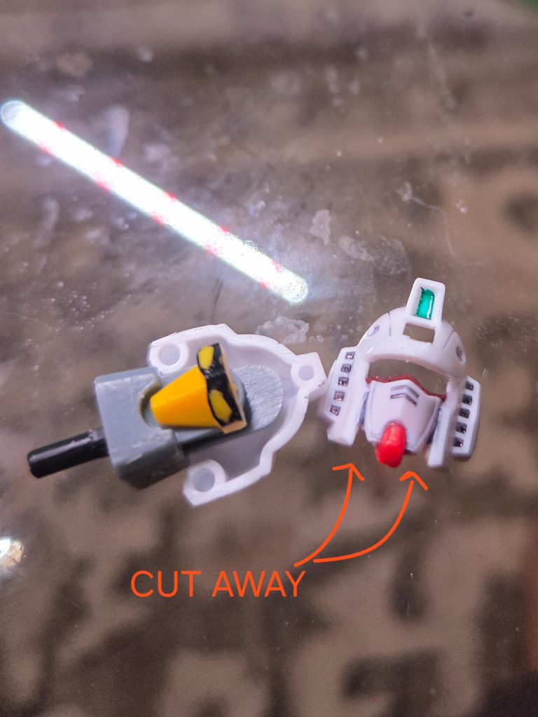 Cut away some plastic to make the face more accurate to regular RX-78.