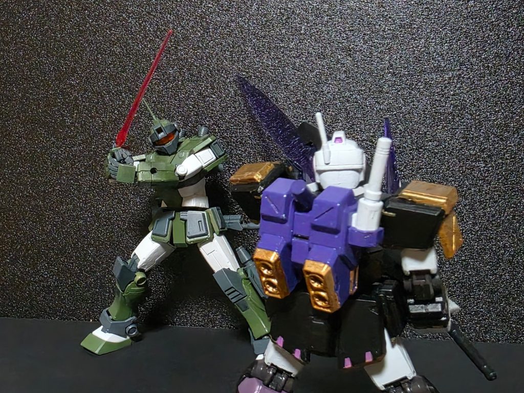 最後は以前製作したジム・ストライカー（キュアアルカナ・シャドウ イメージカラーver.）と激突!!この2機がなぜ戦っているのかは今後明らかになったり、ならなかったり?また、X(Twitter)の方では本機の有名なパイロットであるフランシス・バックマイヤー中尉と共に、様々なMSと掛け合いを行う予定です!!(こっちのつぶやきでもやるかも?)今回の作品解説は以上です！ご覧いただきありがとうございました…。