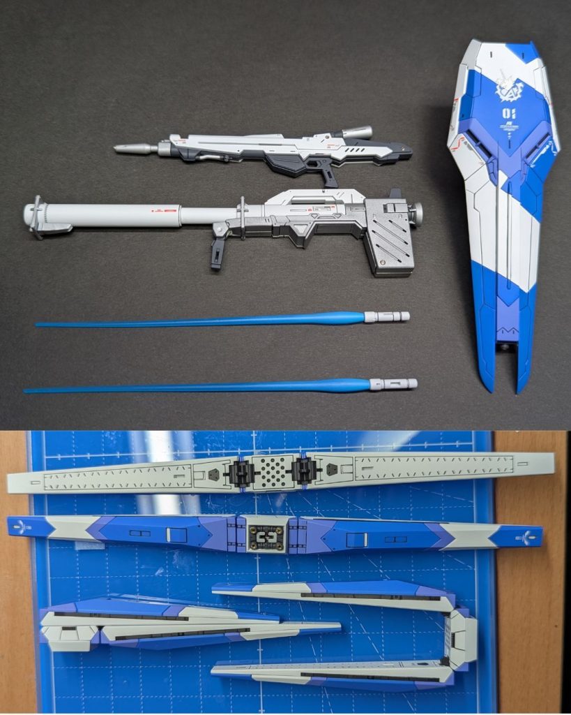 最後に武器類です。自分にしては珍しく、サーベルエフェクトも塗装しました。センスなさ過ぎて全然発光してるように見えませんがね。蛍光ブルーをベースにしてるので、一応ブラックライトで発光はします。ファンネルの可動は残してあります。写真の為に変形させていますが、たぶん二度と動かさないです。以上、RGよりHi-νガンダムでした。写真撮影の環境がダメすぎて酷い写真ばかりで申し訳ない。いい加減ライト位買わないとですね。ご覧いただきありがとうございました！！