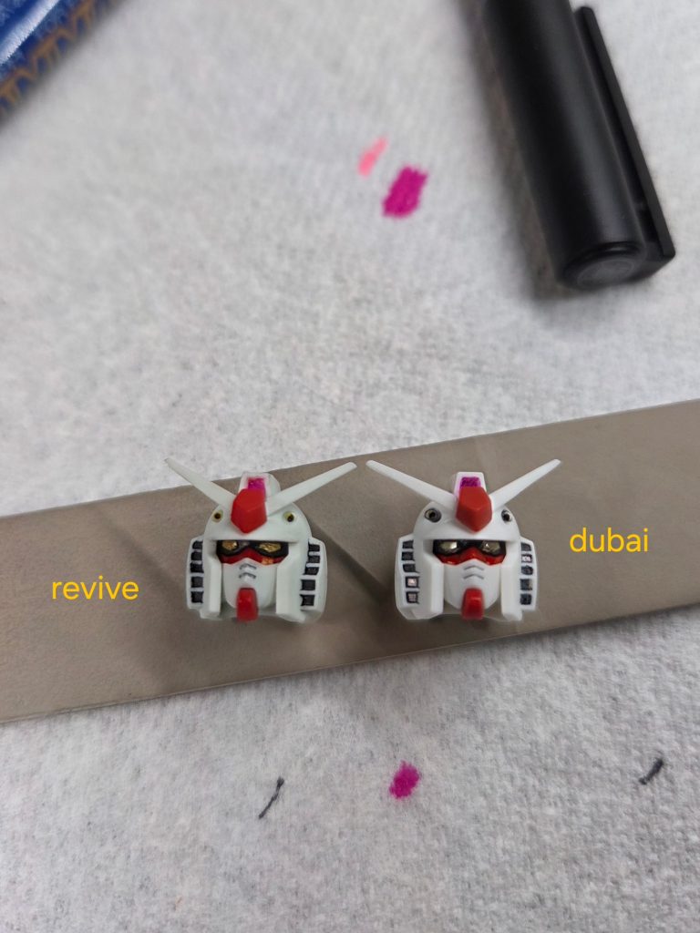 The face looks better than revive with a thicker red section, slimmer mouth and larger eyes?