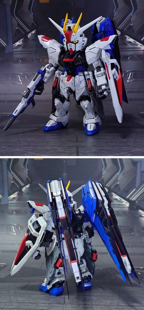 MGSD フリーダムガンダムの前後ろ。工作は、ゲート痕処理、パーティングライン・段ズレ・ヒケの対処、面出し、エッジ尖らせ、穴開け、市販ディティールアップパーツの貼り付け・埋め込み、可動軸への真鍮線打ち込みを実施。ウイングバインダー先端は、安全基準・強度確保のため切り欠かれている部分を延長して削る方向で尖らせ。ビームサーベルの連結は省略し、噛み合わせ部分を削ってディティールアップパーツに置換しました。