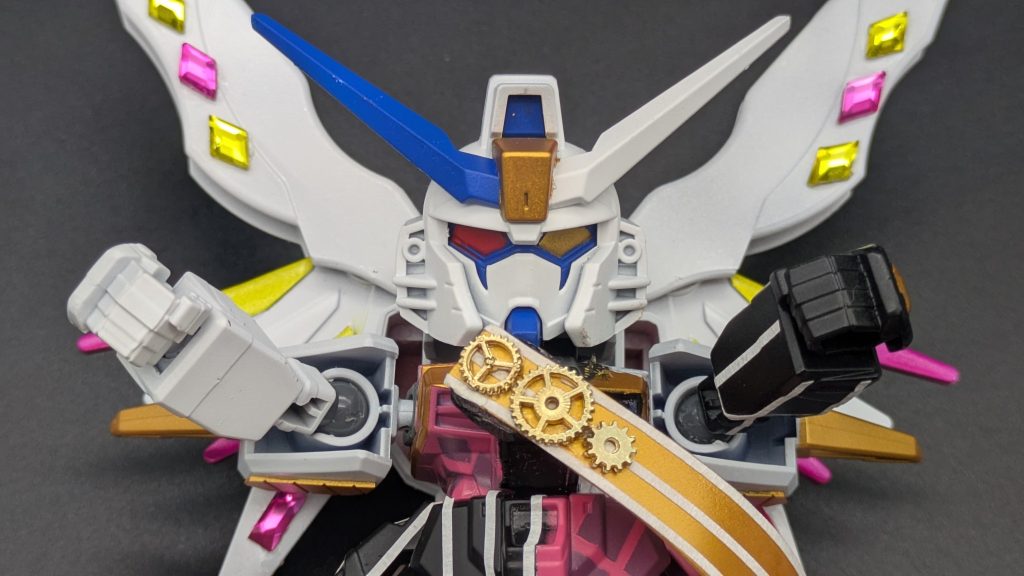 胸の飾りは100均のレジンコーナーに売っていた歯車パーツを使用。ガンダム顔で白ベースに青だとそこはかとないペルフェクティビリティ感がorz