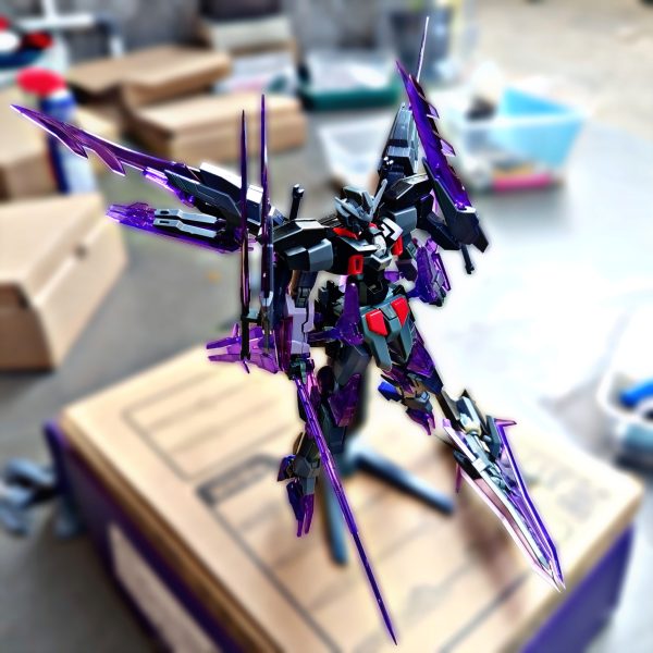 This time, I wanted to develop the Gundam AGE-2 into an antagonist Gunpla that I imagined as a true rival for the Wing Gundam Zero Honoo.After reading Gundam Build Fighters Honoo Try, I became interested in the idea of a Gunpla having a strong identity and character as a rival. From there, I tried to create my own interpretation.The base is the Gundam AGE-2, combined with parts from the HG Transient Glacier, Option Weapon Joker, and a halberd/spear-type weapon as its main weapon.While building it, I focused not only on the appearance but also on joint compatibility and mechanical continuity between the different parts. This approach was inspired by the mechanical design style of Kanetake Ebikawa, making the different components feel integrated rather than simply attached together.For the overall concept, I was inspired by Dark Rebellion Xyz Dragon from Yu-Gi-Oh! ARC-V. I really like how the monster combines a dark, sharp, aggressive, yet elegant appearance.I wanted to translate those characteristics into a mobile suit:Dark + Sharp + Aggressive + Elegant.For me, the goal of this custom is not simply to make an AGE-2 with additional parts, but to create a Gunpla with its own identity as an antagonist and a worthy rival to Wing Zero Honoo.Base: Gundam AGE-2Additional Parts: HG Transient GlacierAdditional Weapons: Option Weapon Joker + Halberd/SpearConcept: Dark Rebellion Xyz Dragon × Gundam AGE-2Design approach: Joint compatibility & mechanical continuity(4枚目)