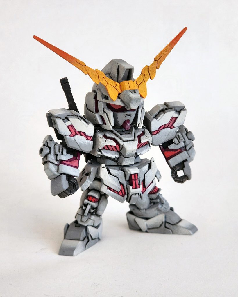 時は流れて9月。現在取り組んでいる「ライトニングガンダム」の塗装に本格的に着手する前に、まずは塗装の技術を磨いておこうと考えています。また、Discordグループの友人たちとの間で企画された「テーマ別チャレンジ」に向けた作品も作りたいと思っていました。そこでうってつけなのが、手元にあった古い「ユニコーンガンダム」です。塗装の作業は本当に楽しかったですし、仕上がりにも大満足しています。何より、このキットを無事に再生できたことが一番嬉しいですね。とはいえ、次に控えているライトニングガンダムを塗るまでには、まだ検討すべきことがたくさんあります。あれは完璧な仕上がりにしたいですから。それでは、また。最後まで読んでいただきありがとうございました。-Fast forward to September, I’m trying to refine my techniques before I commit to painting my current project, the Lightning Gundam. I’m also trying to create something for a themed challenge amongst friends in a Discord group. I have something perfect for the job, the old Unicorn Gundam.I had so much fun painting this. I’m super happy with the results and even more happy that I was able to save the kit. However, I still have lots to think about before painting my upcoming Lightning Gundam. I want that to be perfect.&nbsp;Until then, take care and thanks for reading.